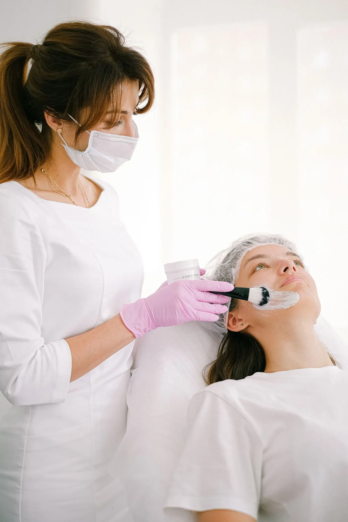 A client relaxing during a facial treatment